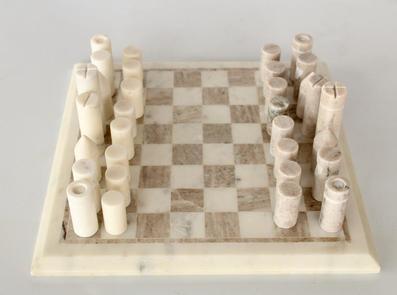 White and beige marble chess board