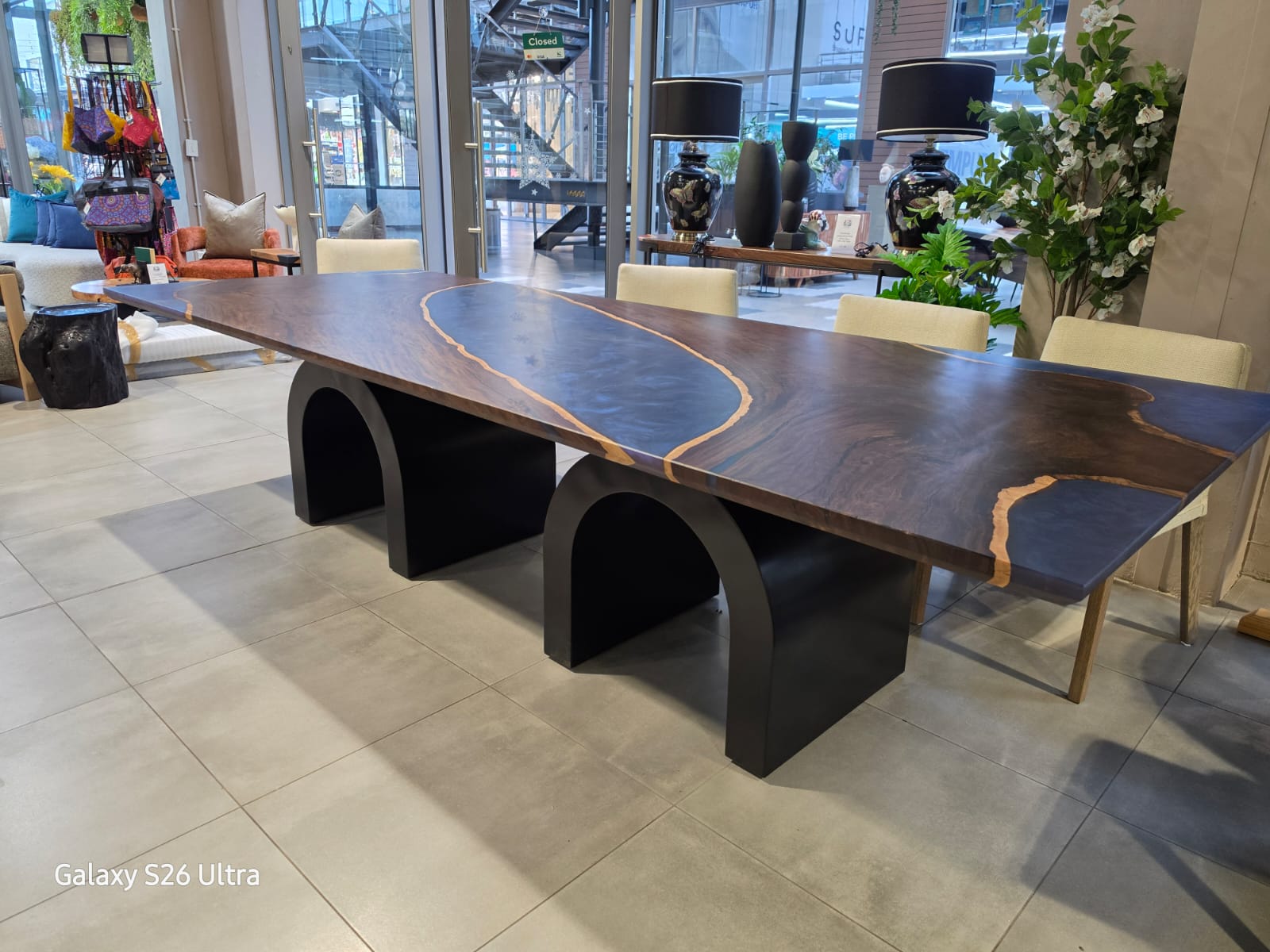 Leadwood table with arched metal legs